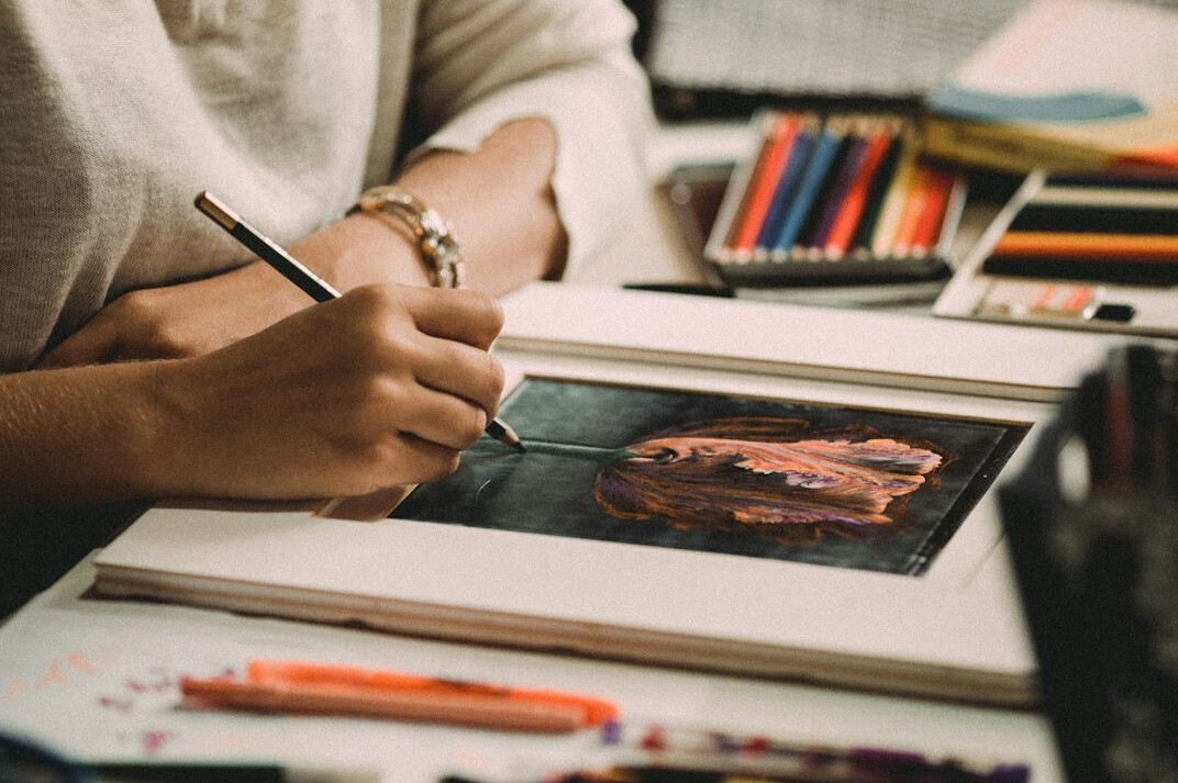 Graphic designer sketching a print advertisement layout
